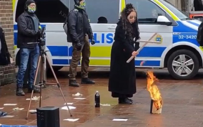 В Швеции женщина сожгла Коран-(видео)